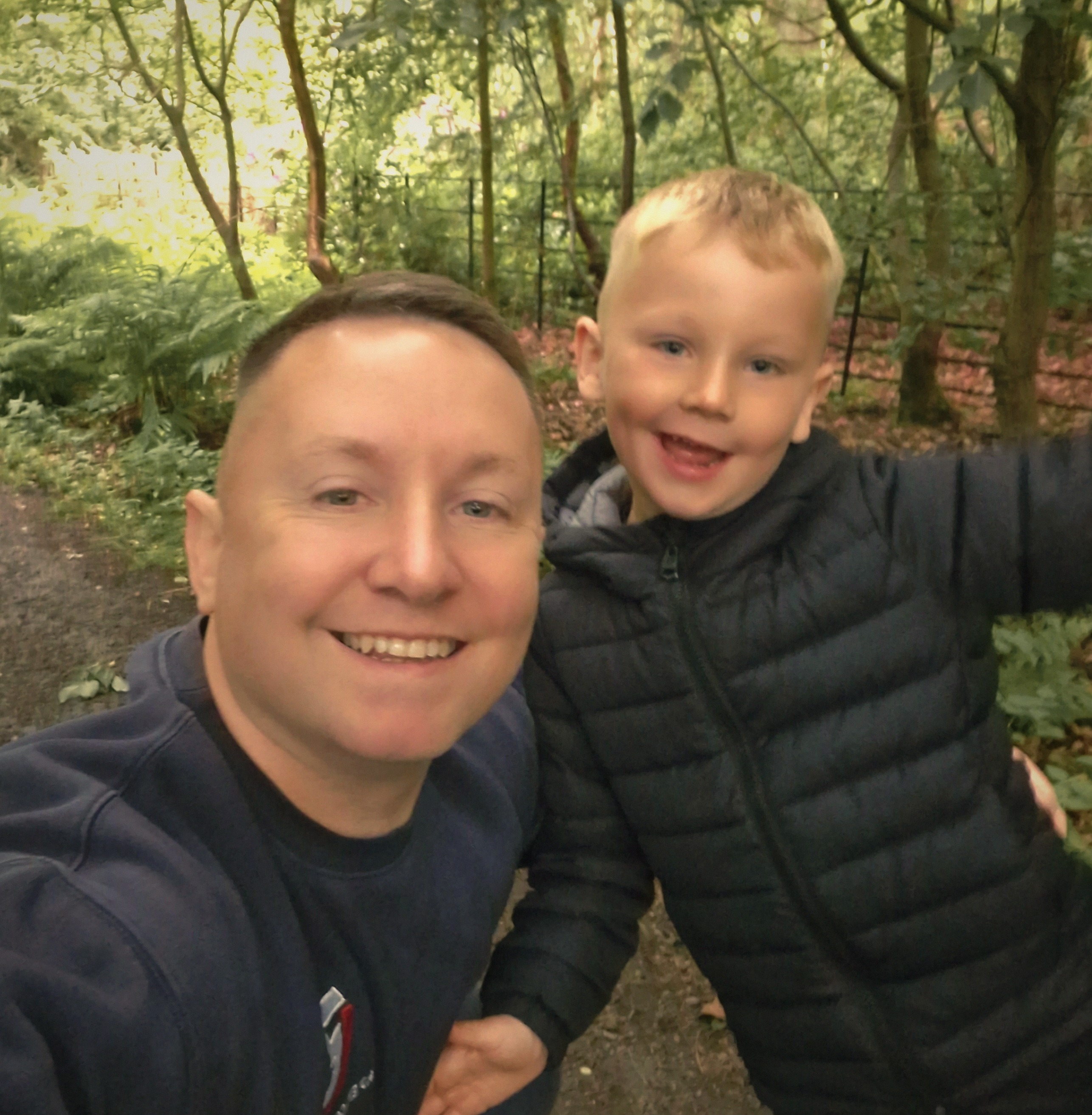 Robbie Inman with his son in the woods, away from the gym floor